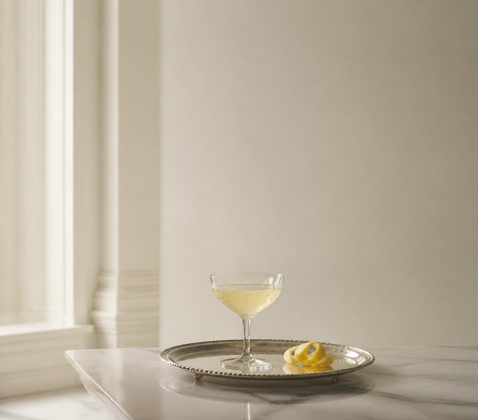 A crystal coupe on a silver tray