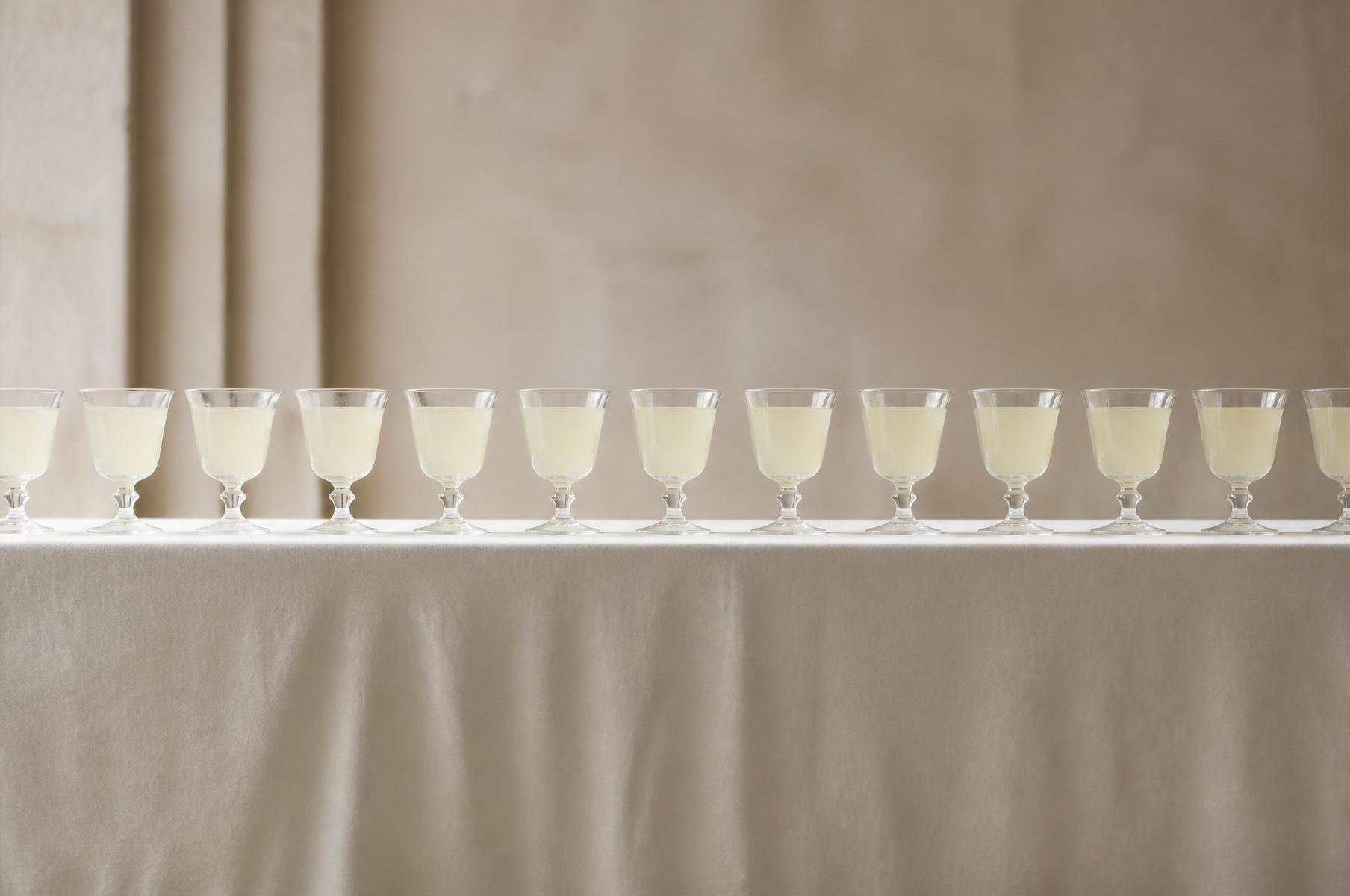 A line of identical crystal tasting glasses